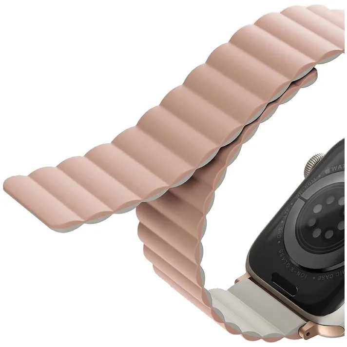 На фото изображено Ремешок силиконовый двусторонний Uniq для Apple Watch (40,41,42 мм), розовый-бежевый